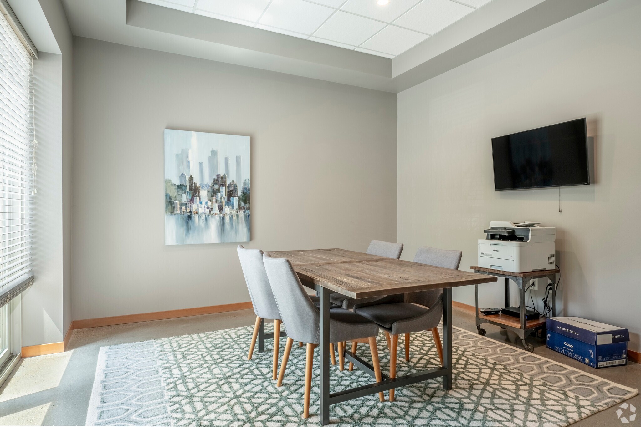 Middleton Station conference room with table, television, and printer